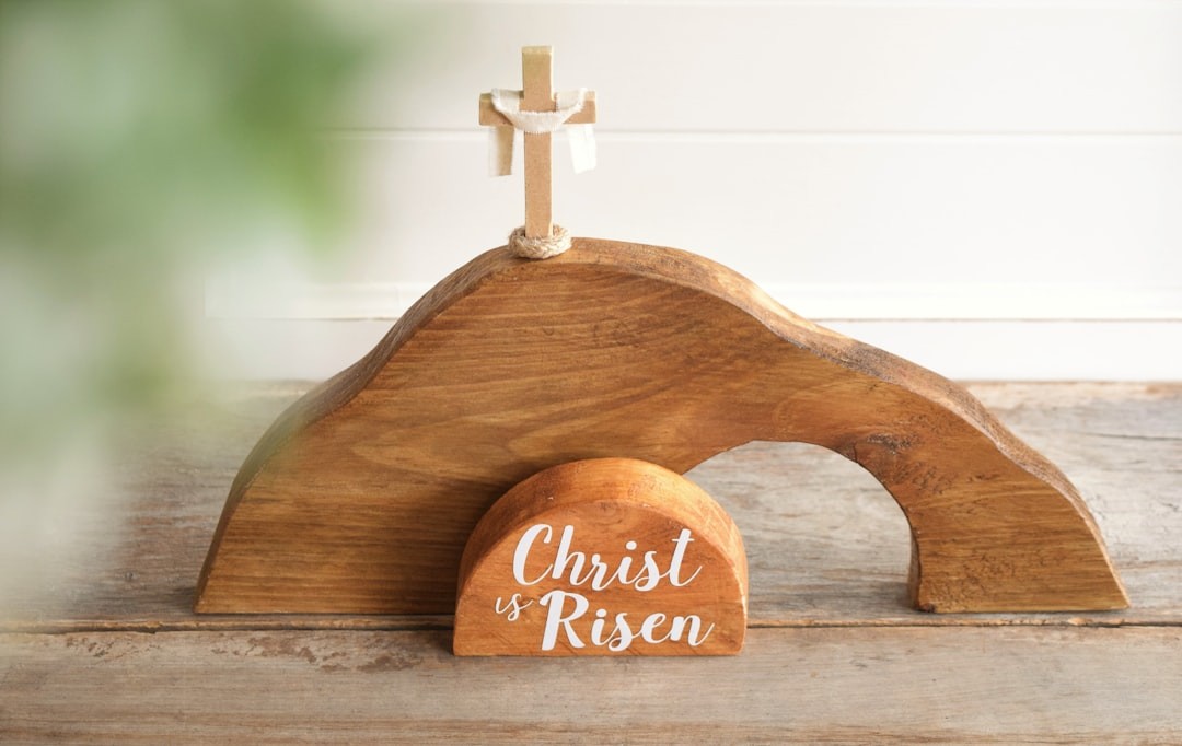 a wooden cross on top of a wooden stand